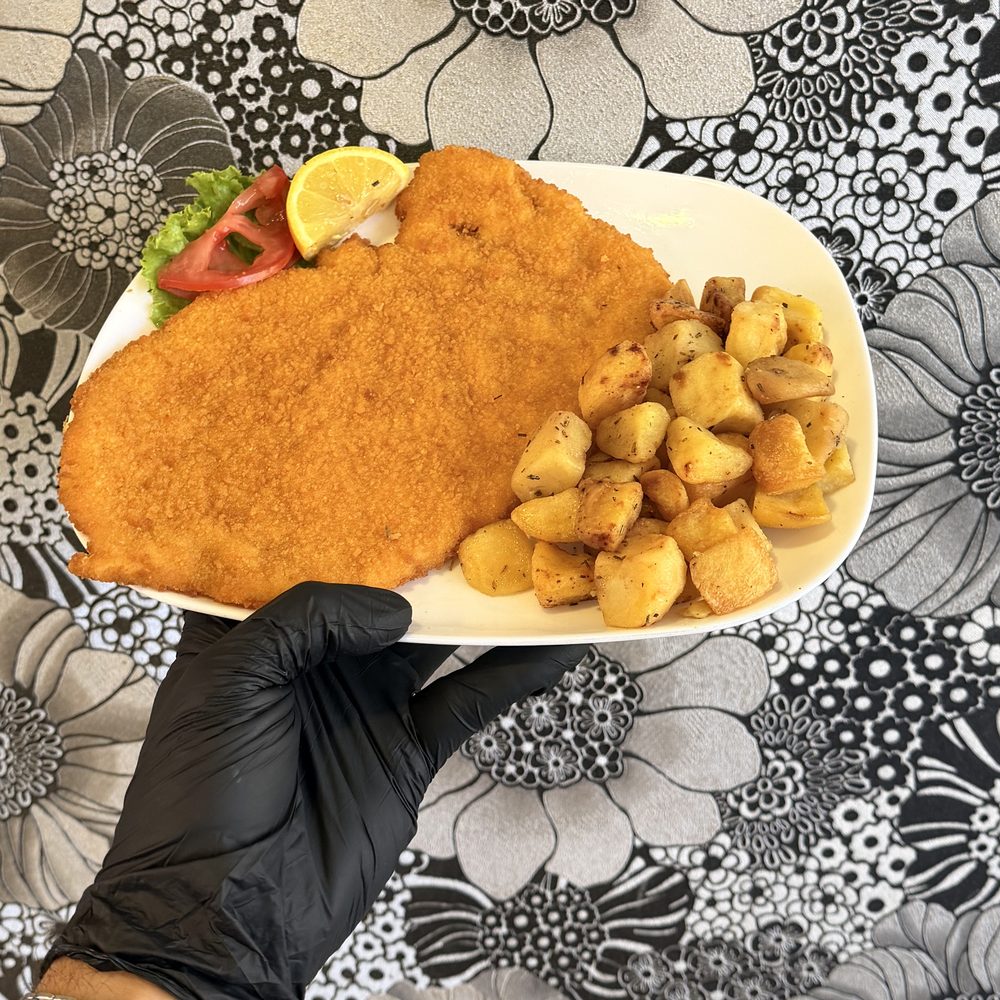 Cotoletta con patate al forno